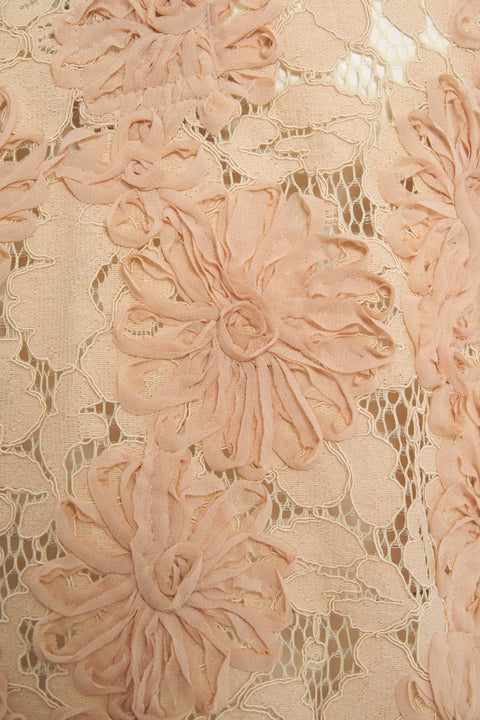 Blusa in pizzo con motivo floreale