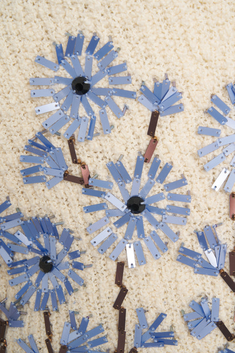 Sweater with floral appliqués