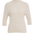 Knit sweater with cable-knit pattern