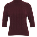 Knit sweater with cable-knit pattern