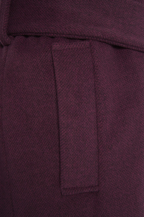 Coat with welt pockets